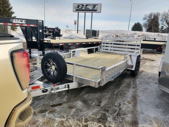 DCT aluminum open utility trailer with a fold-down rear ramp gate