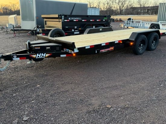 Black H&H tandem-axle car trailer with a wood deck