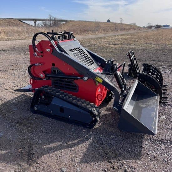 Red and black compact tracked mini skid steer with bucket and grapple attachments